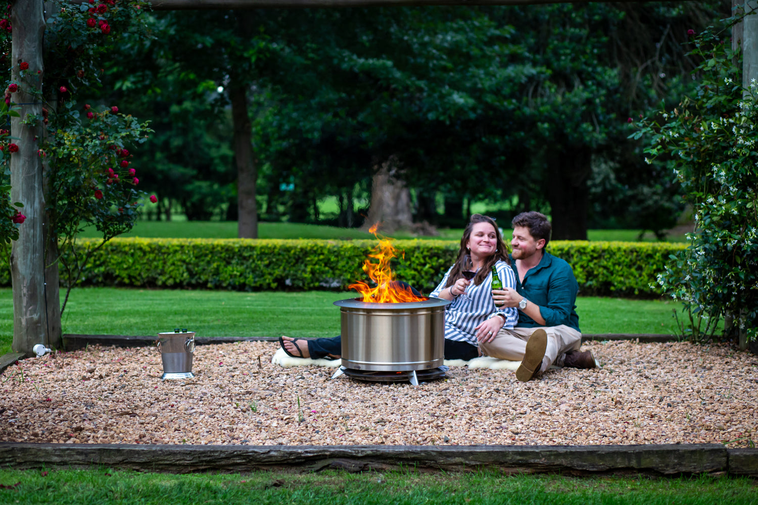 Couple sitting by a smokeless firepit