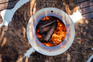 Smokeless firepit burning on an Nguni hide